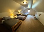 Bedroom 3 with 4 twin beds walk through upper Master to this room